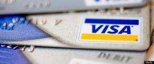 Visa logos appear on credit and debit cards arranged for a p