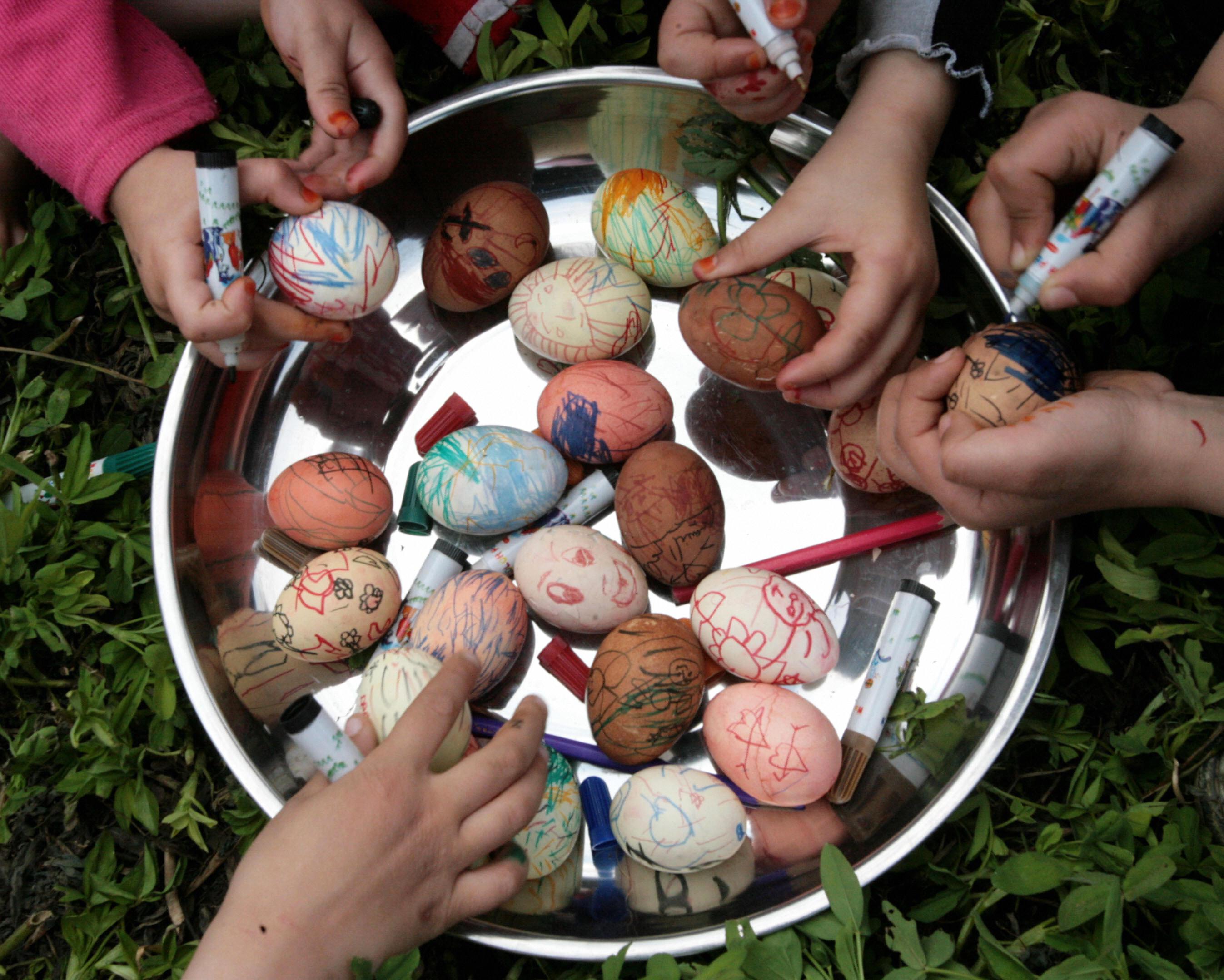 Egyptian children color eggs in the al-J...