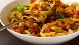 Linguine with prawns and tomato sauce, close up