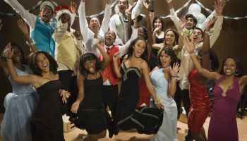 Multi-ethnic teenagers cheering at prom