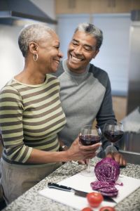 Couple laughing in kitchen together