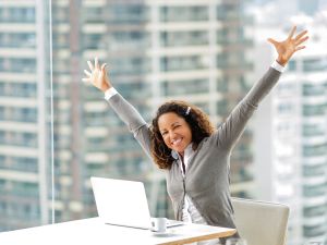 Successful African American businesswoman celebrating her succes.