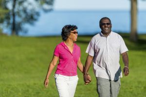 Mature couple together at the park.