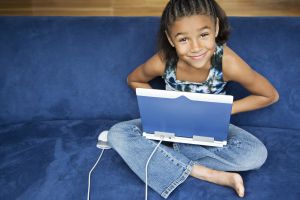 African American girl working on lap top computer