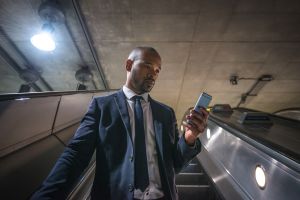 Business man on the phone inside the london tube metro