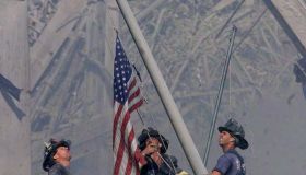Firefighters Raise A U.S. Flag At The Site Of The World Trade Center