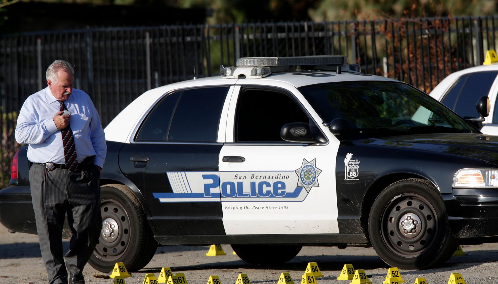 SAN BERNARDINO, CA. AUGUST 22, 2014 --- San Bernardino police investigators at the scene of an offic