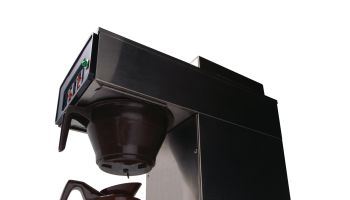 Pot of coffee brewing on automatic drip machine
