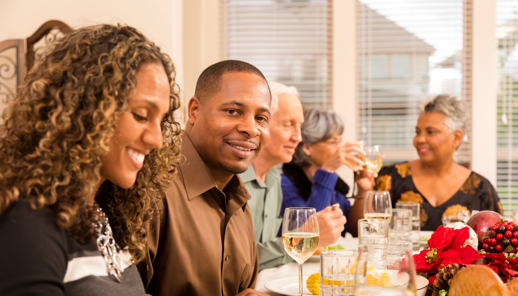 Relationships: Family and friends gather for Christmas dinner party.