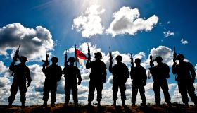 Silhouette of soldiers from the U.S. Army National Guard.