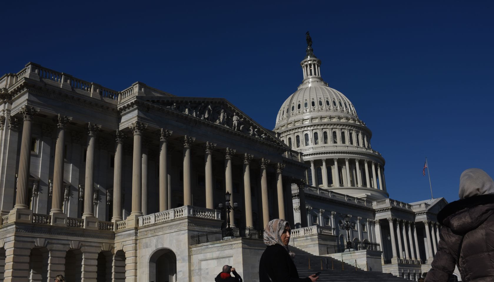 WASHINGTON DC - DECEMBER 15: Tourists gather around the US Cap
