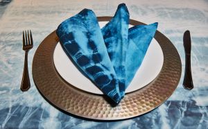 High Angle View Of Blue Napkin In Plate On Table