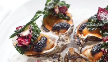 Roasted Oysters with Fried Kale and Parmesan