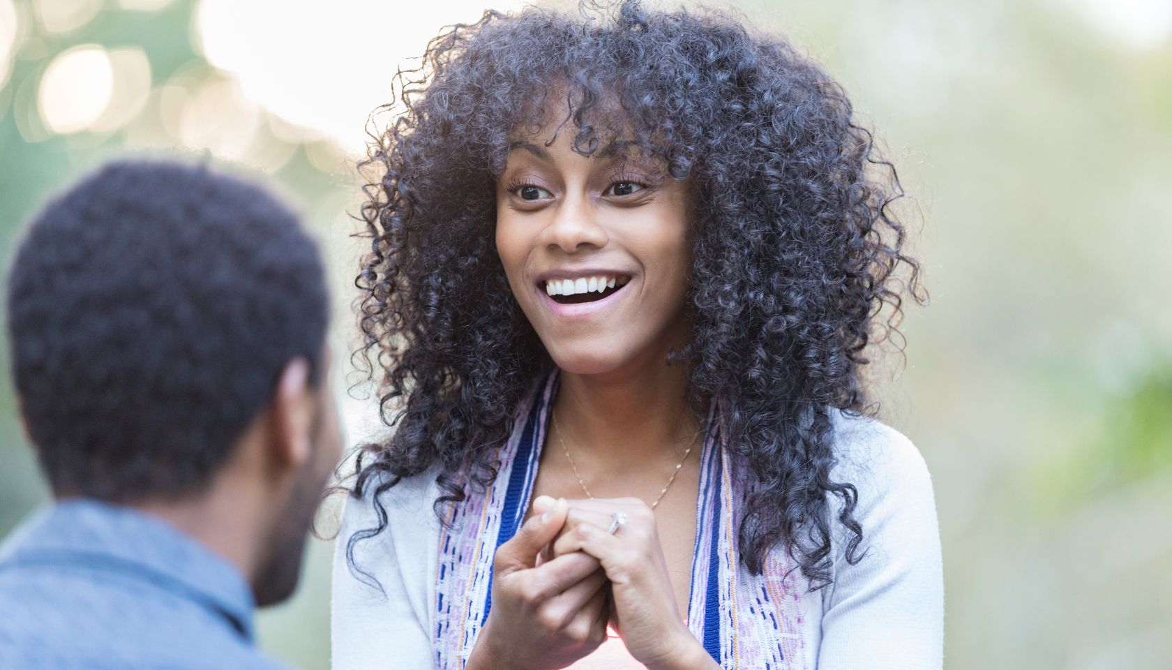 Beautiful mixed race woman accepts boyfriend's marriage proposal