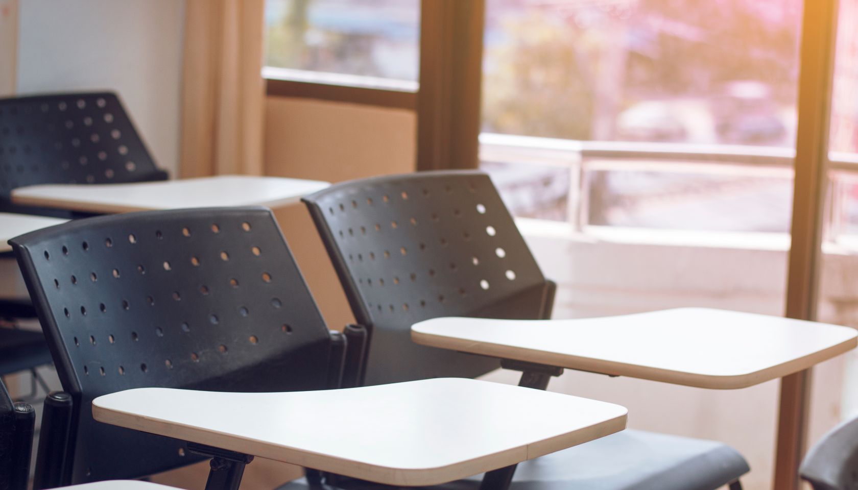 Empty Chairs And Table In Classroom