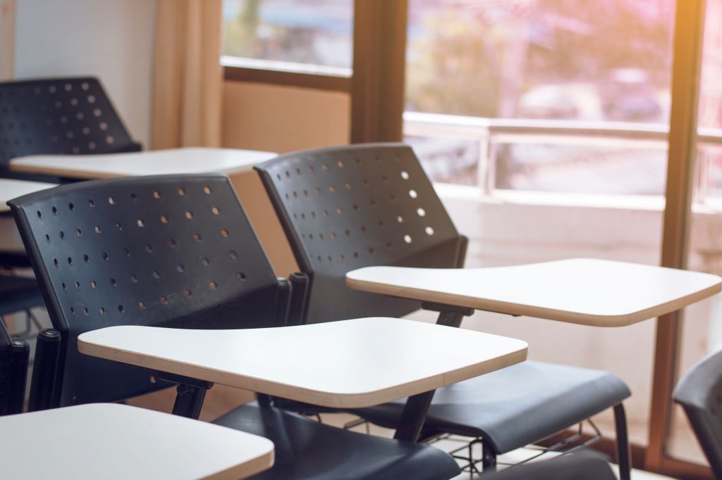 Empty Chairs And Table In Classroom