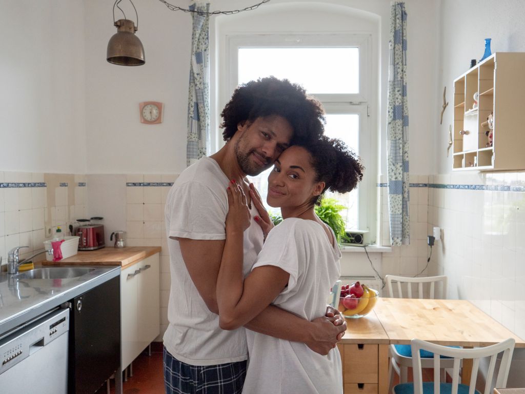 Morning love, couple in kitchen, looking at camera