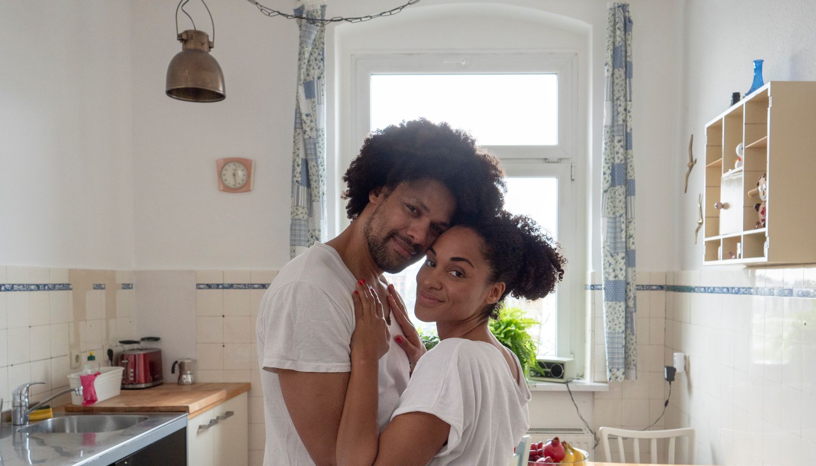 Morning love, couple in kitchen, looking at camera
