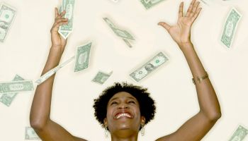 Woman Catching Falling Money