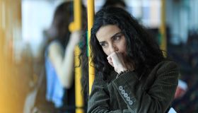 Pensive woman traveling with public transport