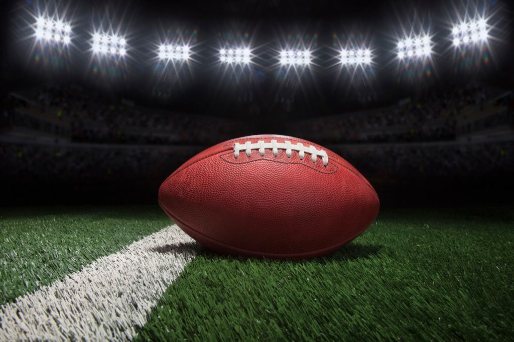 Close-Up Of American Football On Field At Night