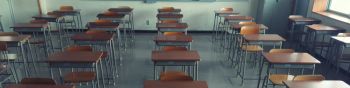 Empty Chairs In Classroom At School