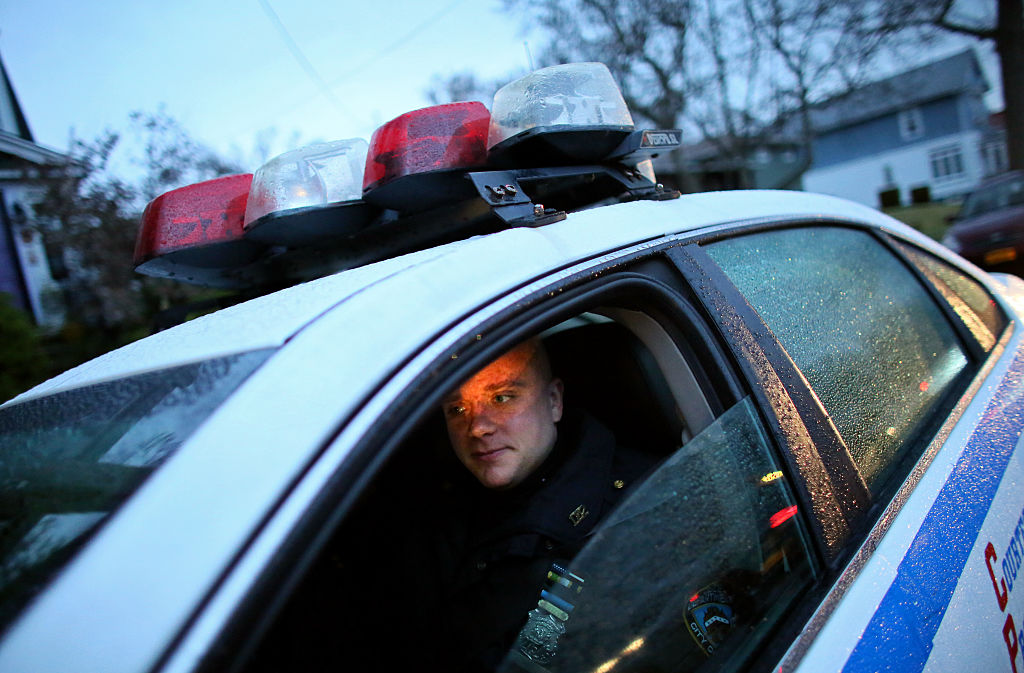 STATEN ISLAND, NY - DECEMBER 05: Police officers guard the hous