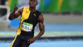 Usain Bolt of Jamaica reacts at the end of the men's 100m...