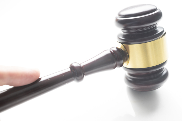 Judge passing sentence with his mallet of judge.