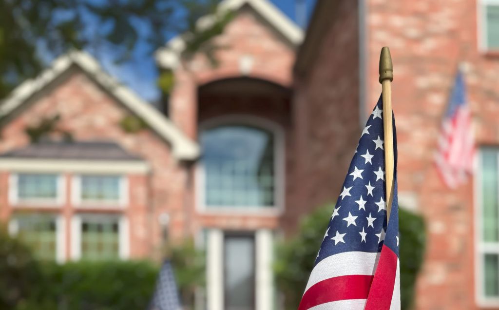American flags displayed in front of a southern home