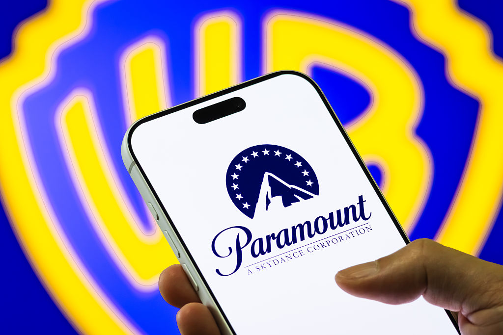 Paramount Logo on Smartphone Against Warner Bros. Discovery Background