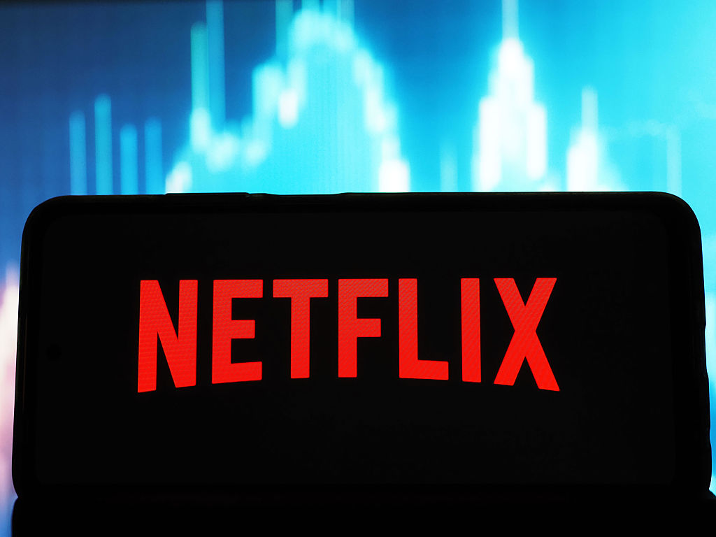 In this photo illustration, the Netflix, Inc. logo seen...