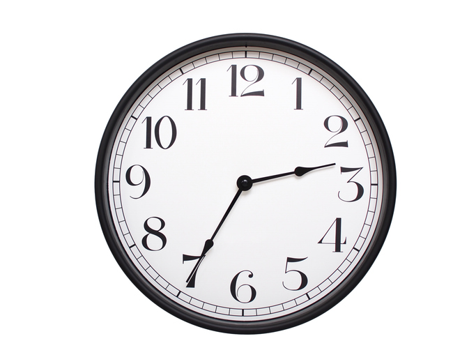 Round analog wall clock with a black frame, white face, and bold black numerals. showing 02:35 or 14:35. Isolated on a white background. Ideal for time-related themes.