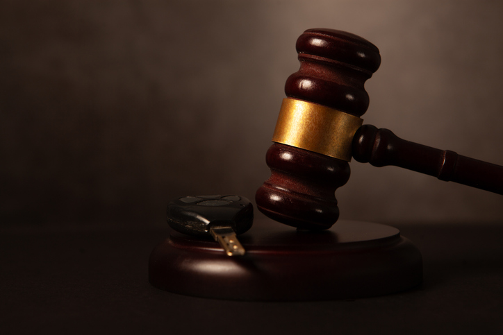 Law theme, mallet of judge, wooden gavel on black background