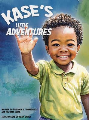 A smiling young boy holding a book titled "Kase's Little Adventures