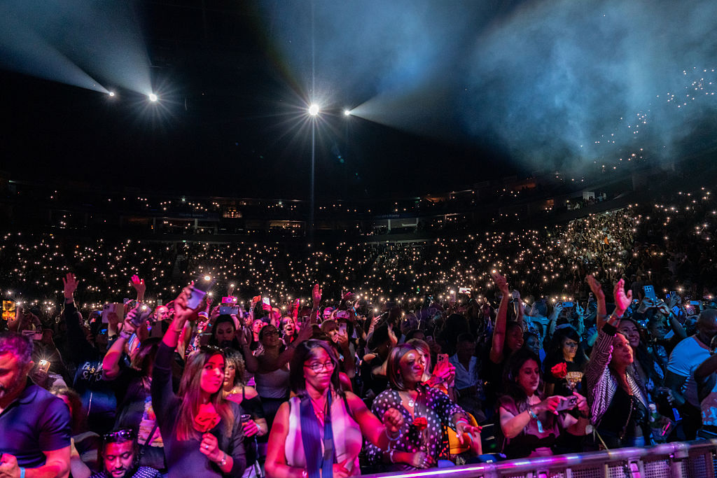 A view of the audience enjoying and cheering as Blackstreet