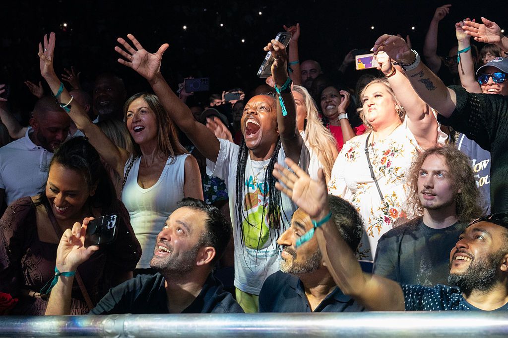 A view of the audience enjoying and cheering as Blackstreet